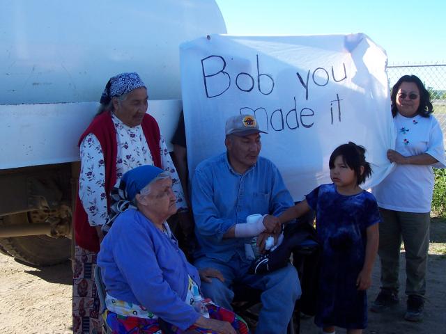 Connie Rae, Bob Rae, his god child shakes his hand, her name is Francine Rae, Sally is holding the banner, as one of the elders,