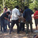 Cutting the potatoes, and going to take them to the community hall.