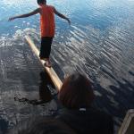 Tyler Meekis, practising for the walking log contest.  With is practices, he was one of the winners for seventy five dollars.